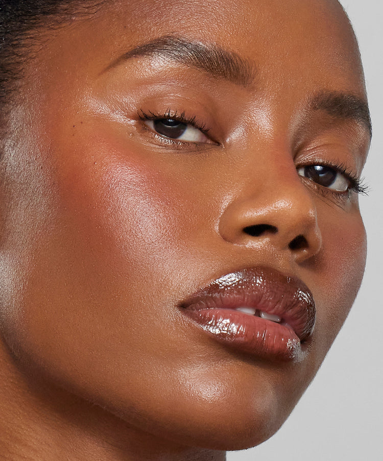 | desc: Model wears Lip Sculpt & Lip Gloss in Sepia