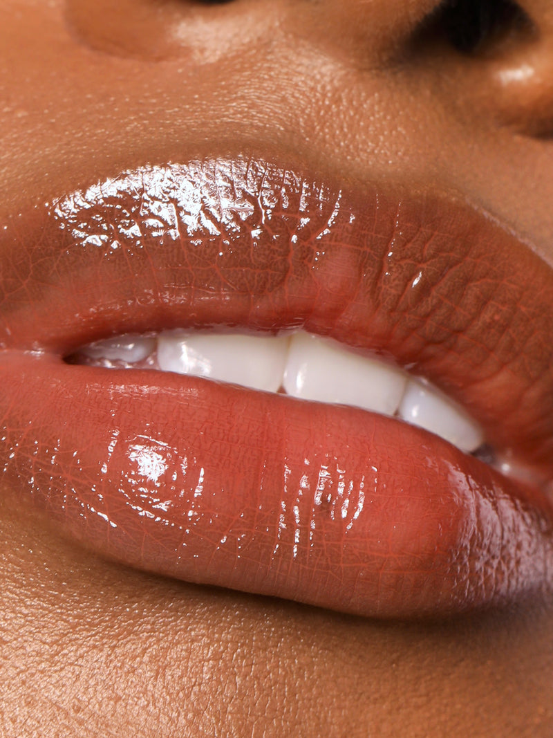 CLOSE UP OF LIPS WEARING REFY LIP GLOSS IN DUSK
